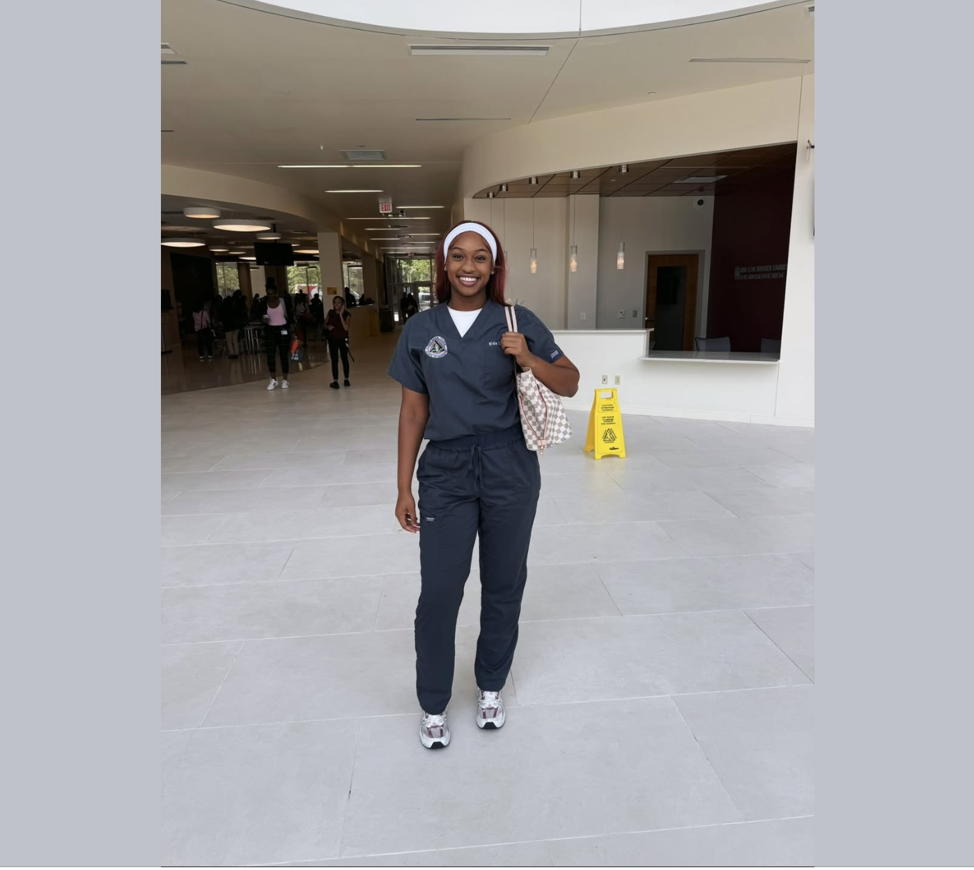 N'dia Metcalf in dental school scrubs